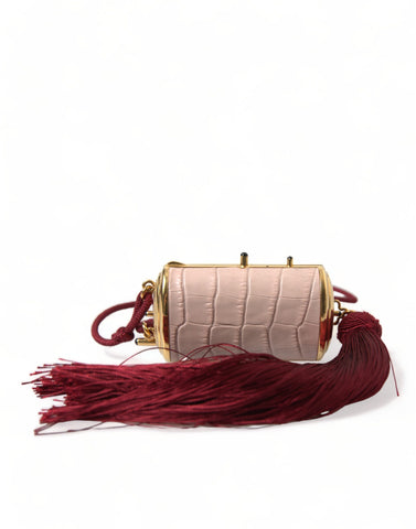 Pink exotic leather mini makeup bag with tassel and mirror from Dolce & Gabbana, featuring a compact, stylish design.
