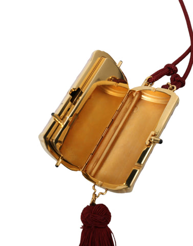 Pink exotic leather mini makeup bag with tassel and mirror from Dolce & Gabbana, featuring a compact, stylish design.