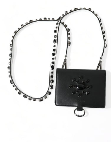 Black leather card holder wallet with crystal embellishments from Dolce & Gabbana, featuring sleek design and compact size.