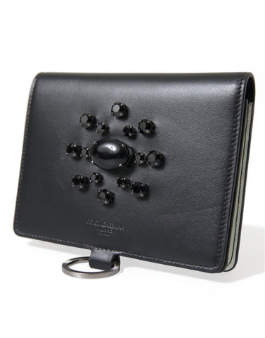 Black leather card holder wallet with crystal embellishments from Dolce & Gabbana, showcasing a compact and elegant design.