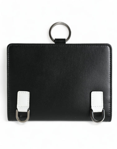 Black leather card holder wallet with crystal embellishments by Dolce & Gabbana, showcasing a sleek and elegant design.