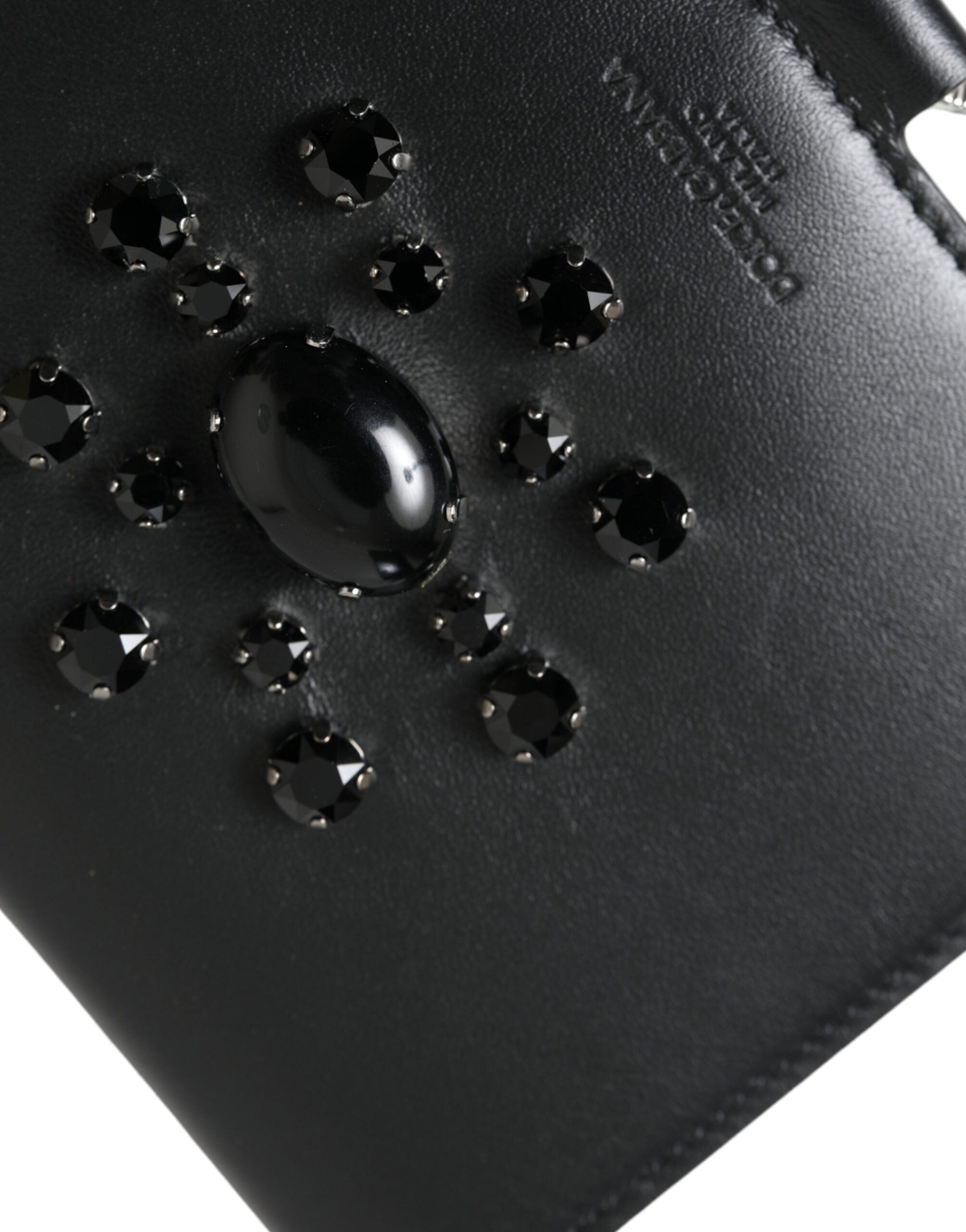Black leather card holder wallet with crystal embellishments by Dolce & Gabbana, featuring multiple card slots and sleek design.