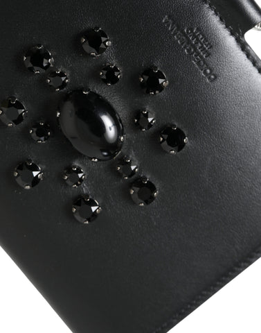 Black leather card holder wallet with crystal embellishments by Dolce & Gabbana, featuring multiple card slots and sleek design.