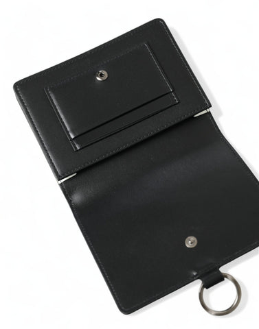 Black leather card holder wallet with crystal embellishments from Dolce & Gabbana, featuring multiple card slots and a sleek design.