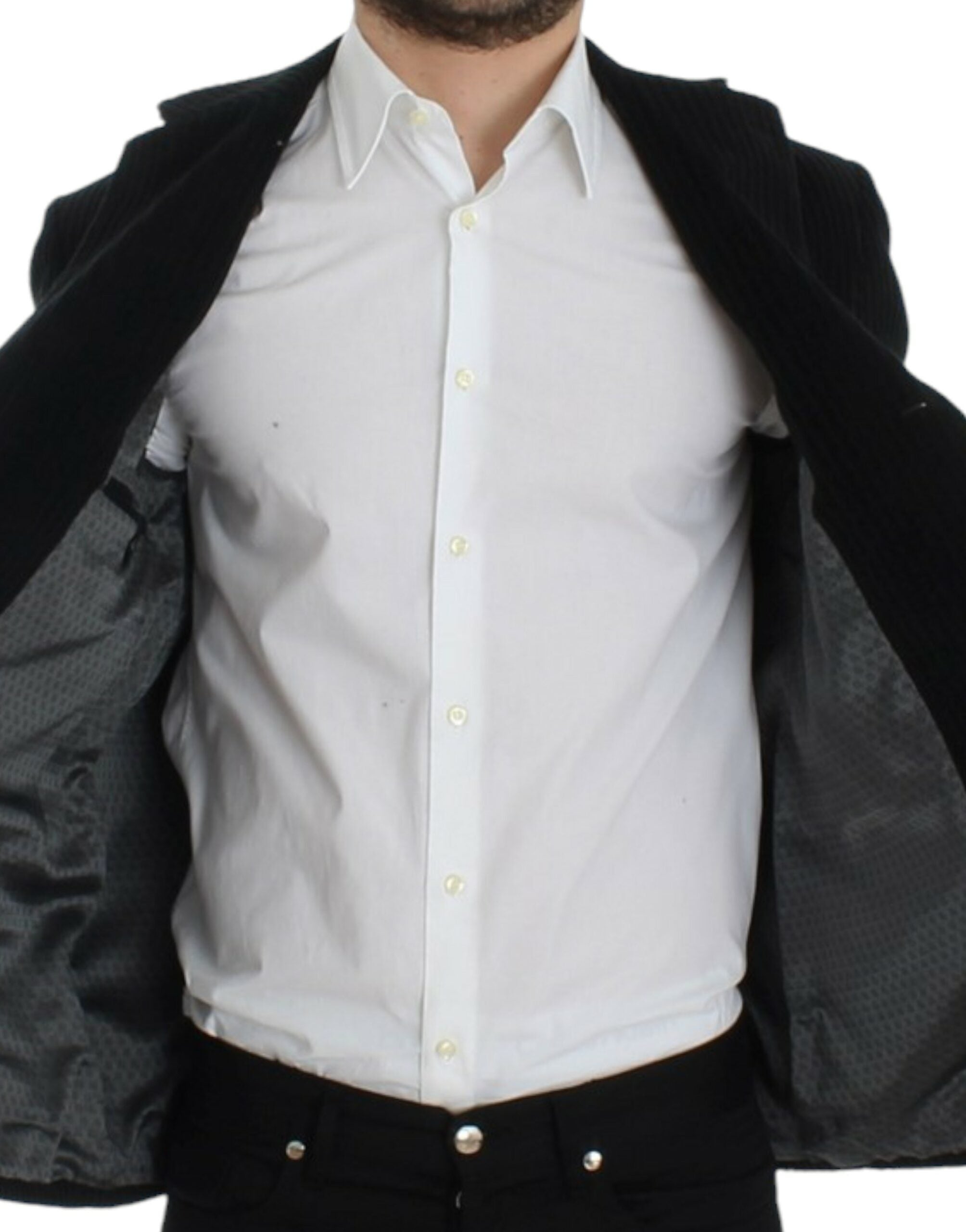 Black Manchester Martini blazer by Dolce & Gabbana, tailored fit with classic lapels, showcased on a hanger.