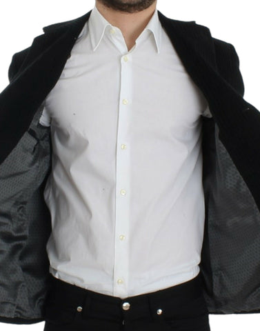 Black Manchester Martini blazer by Dolce & Gabbana, tailored fit with classic lapels, showcased on a hanger.