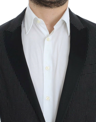 Black wool slim Martini blazer by Dolce & Gabbana, tailored fit with lapel collar and button closure, shown on a mannequin.
