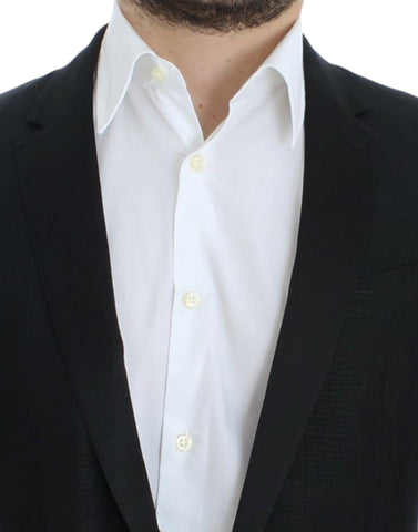 Black wool Martini slim blazer by Dolce & Gabbana, tailored fit with notch lapel and sleek design, displayed on a hanger.