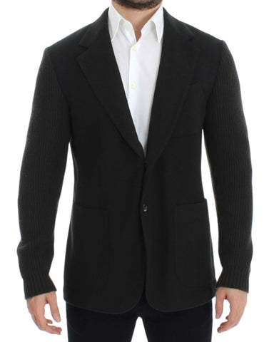Green cashmere Dolce & Gabbana two-button blazer shown on a hanger, close-up of fabric and tailored fit.