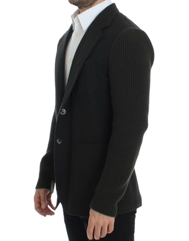 Green cashmere two-button blazer by Dolce & Gabbana, featuring a tailored fit and classic lapel, displayed on a hanger.