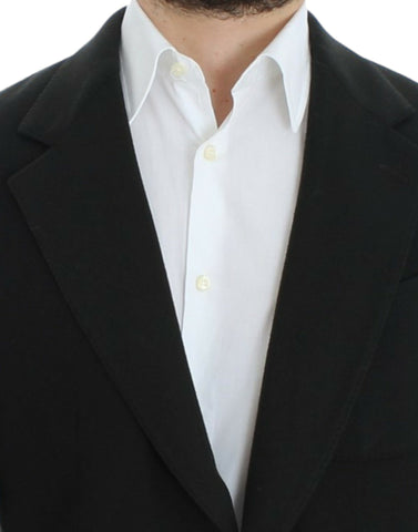 Green cashmere two-button blazer by Dolce & Gabbana, shown on a hanger, highlighting the luxurious fabric and tailored fit.