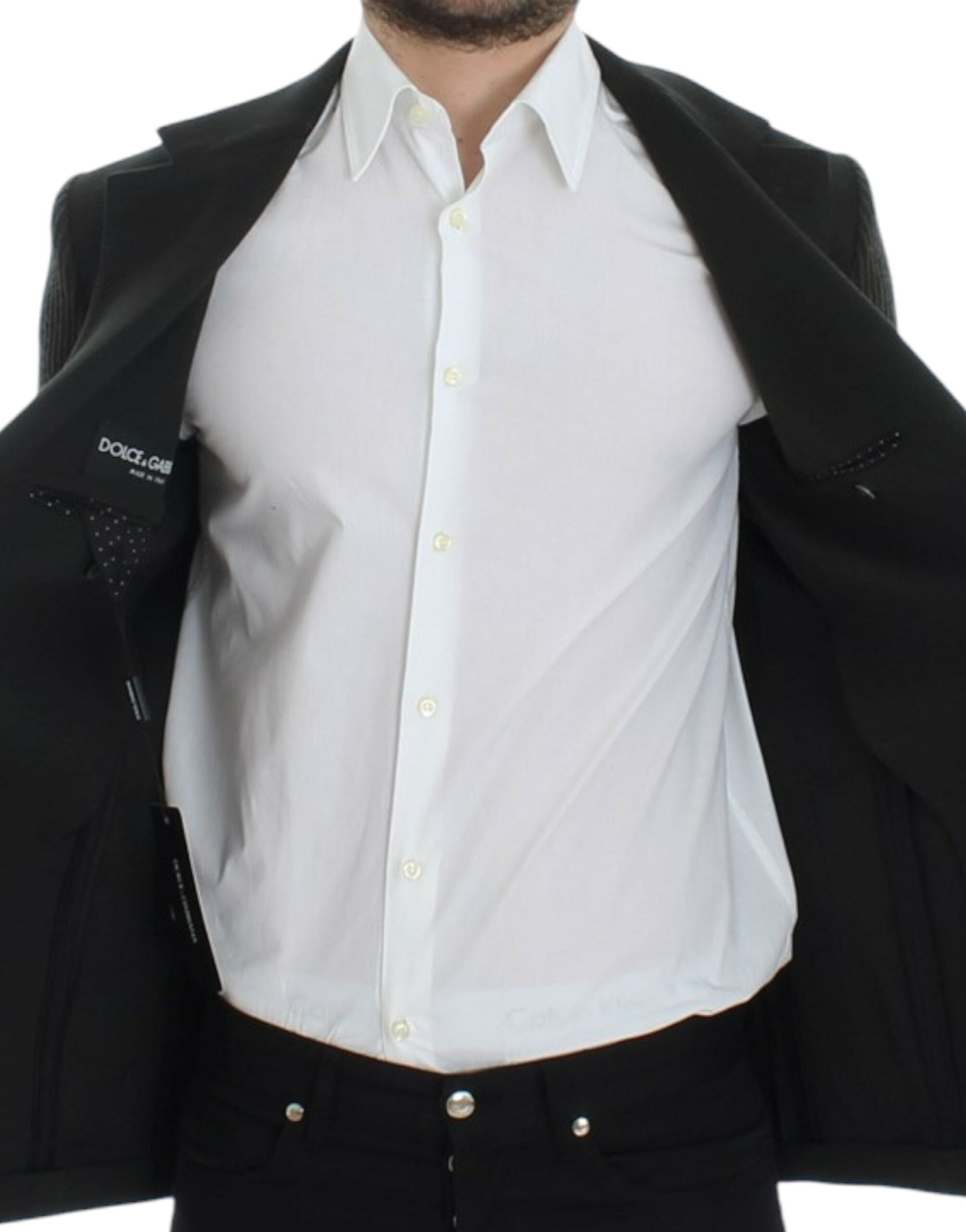 Green cashmere two-button blazer by Dolce & Gabbana displayed on a hanger with detailed fabric texture.