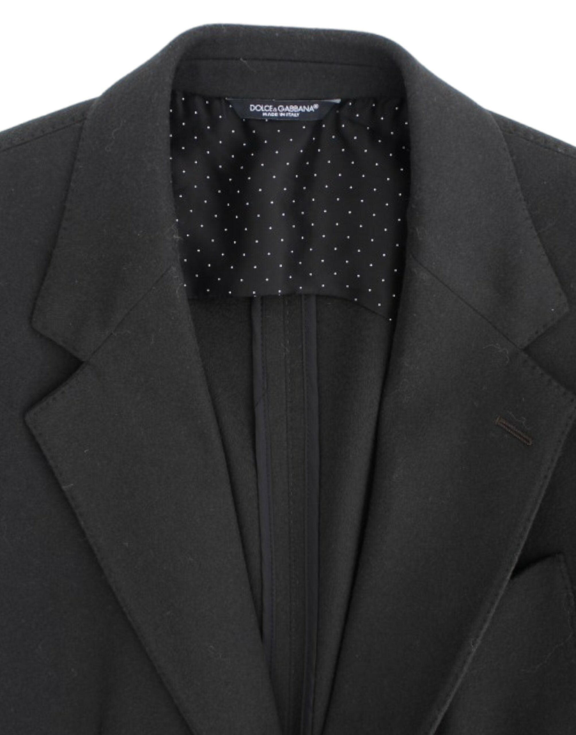 Green cashmere two-button blazer by Dolce & Gabbana, shown on a hanger with detailed fabric texture and classic tailored fit.
