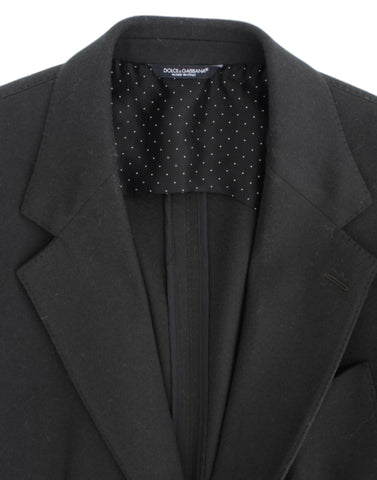 Green cashmere two-button blazer by Dolce & Gabbana, shown on a hanger with detailed fabric texture and classic tailored fit.