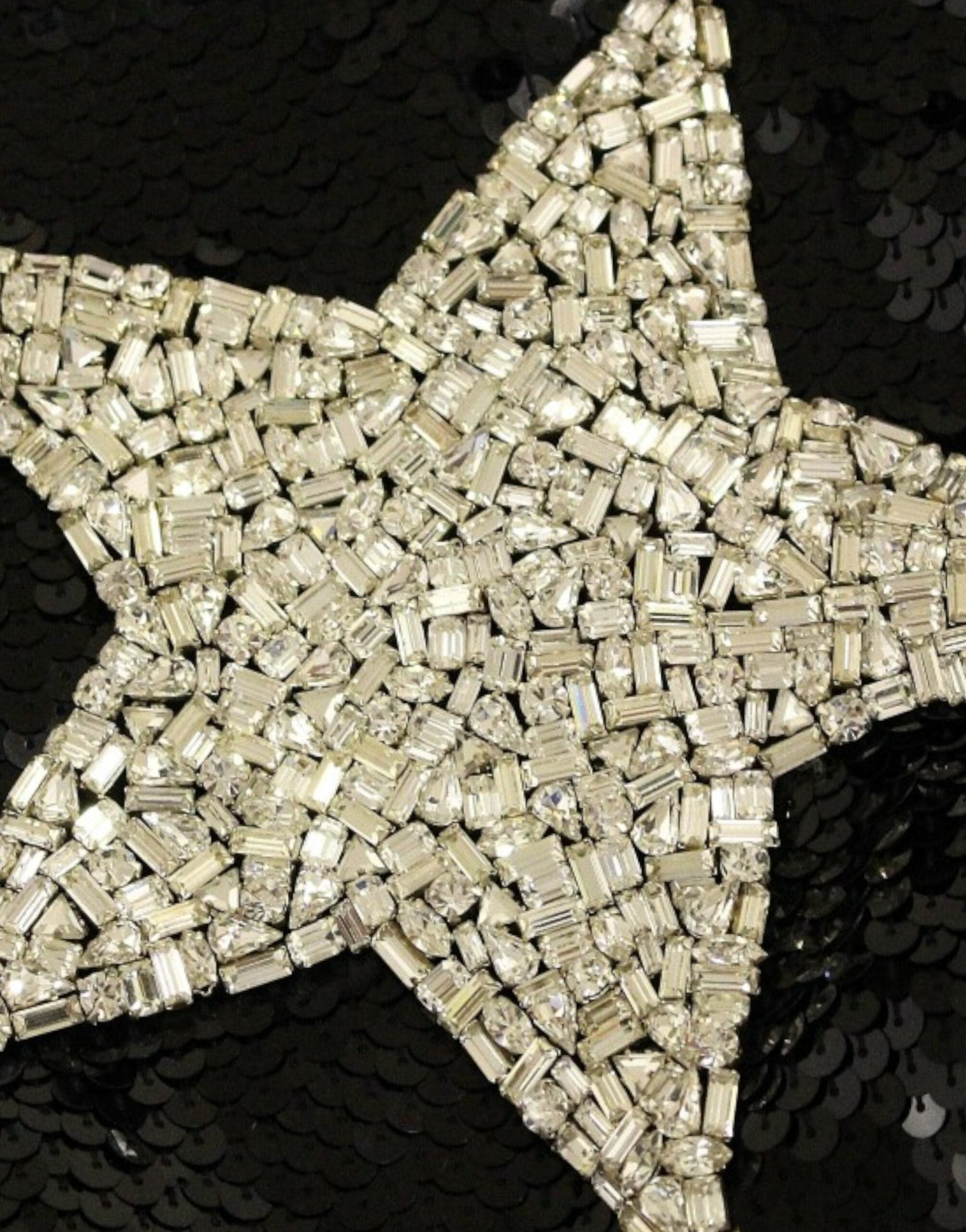 Black crystal Swarovski stars sheath dress by Dolce & Gabbana, featuring a sleek silhouette with sparkling embellishments.