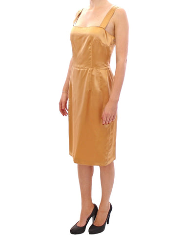 Bronze silk sheath dress by Dolce & Gabbana, fitted with a smooth, shiny fabric and elegant silhouette.