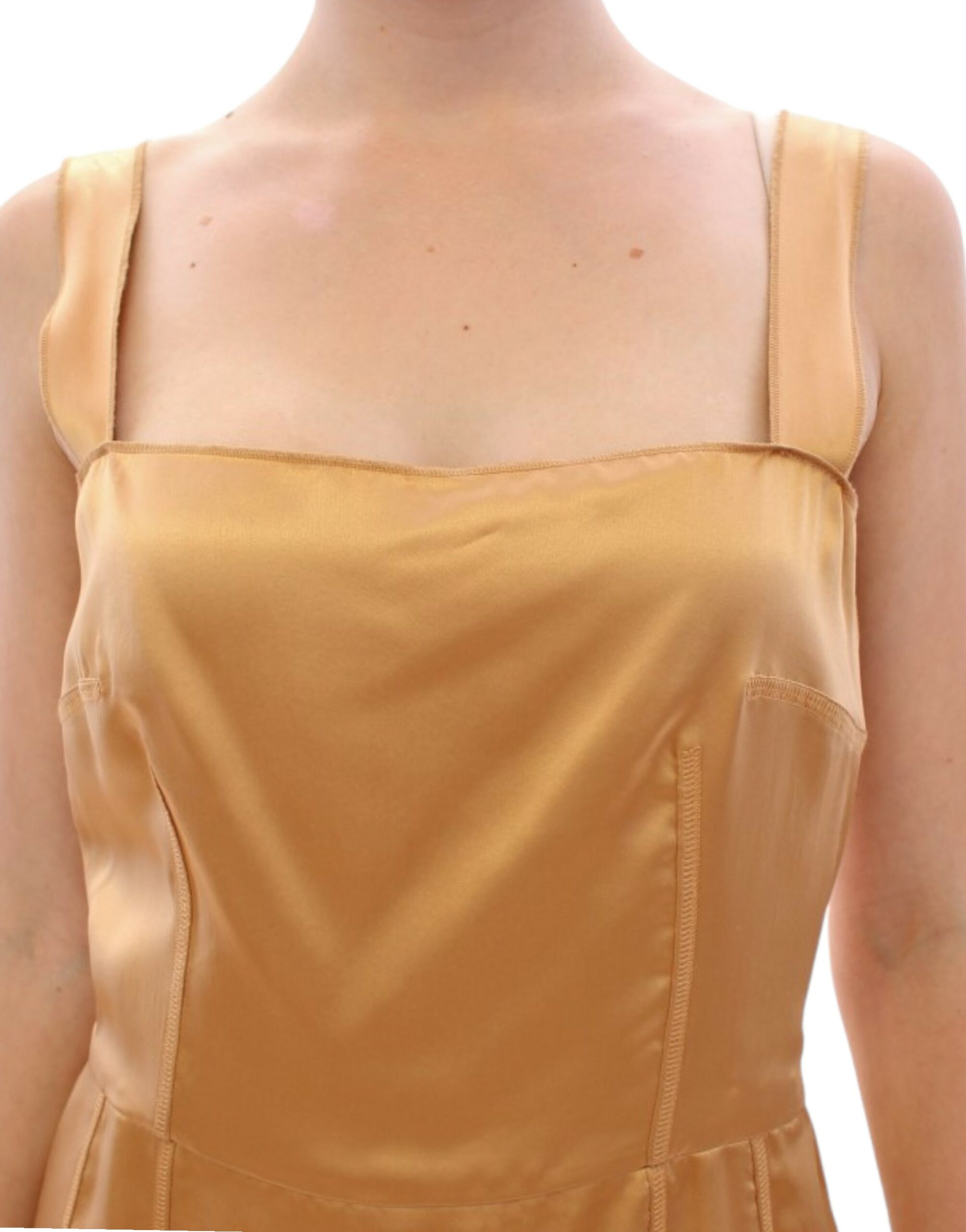 Bronze silk sheath dress by Dolce & Gabbana displayed on a hanger, showcasing its smooth, elegant fabric and classic silhouette.