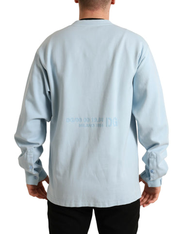 Light blue cotton buttoned pullover sweater by Dolce & Gabbana, featuring a classic knit design and button details.