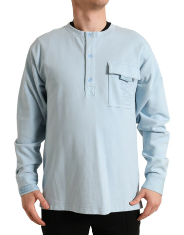 Light blue cotton buttoned pullover sweater by Dolce & Gabbana, featuring a classic crewneck and button details.