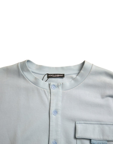 Light blue cotton buttoned pullover sweater by Dolce & Gabbana, shown with a classic fit and detailed front buttons.
