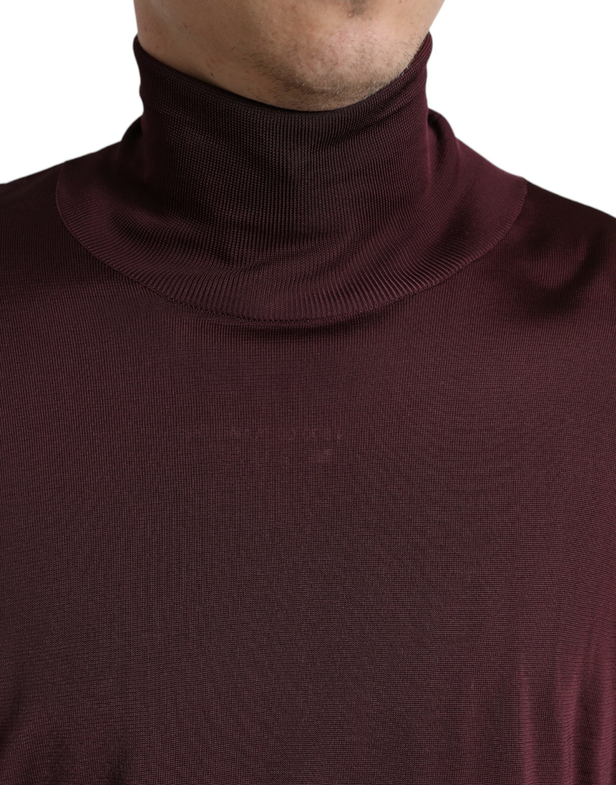 Maroon Dolce & Gabbana viscose turtleneck pullover sweater displayed on a hanger.