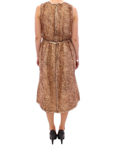 Brown sleeveless silk dress by Dolce & Gabbana, shown hanging on a rack with smooth fabric and elegant design details.