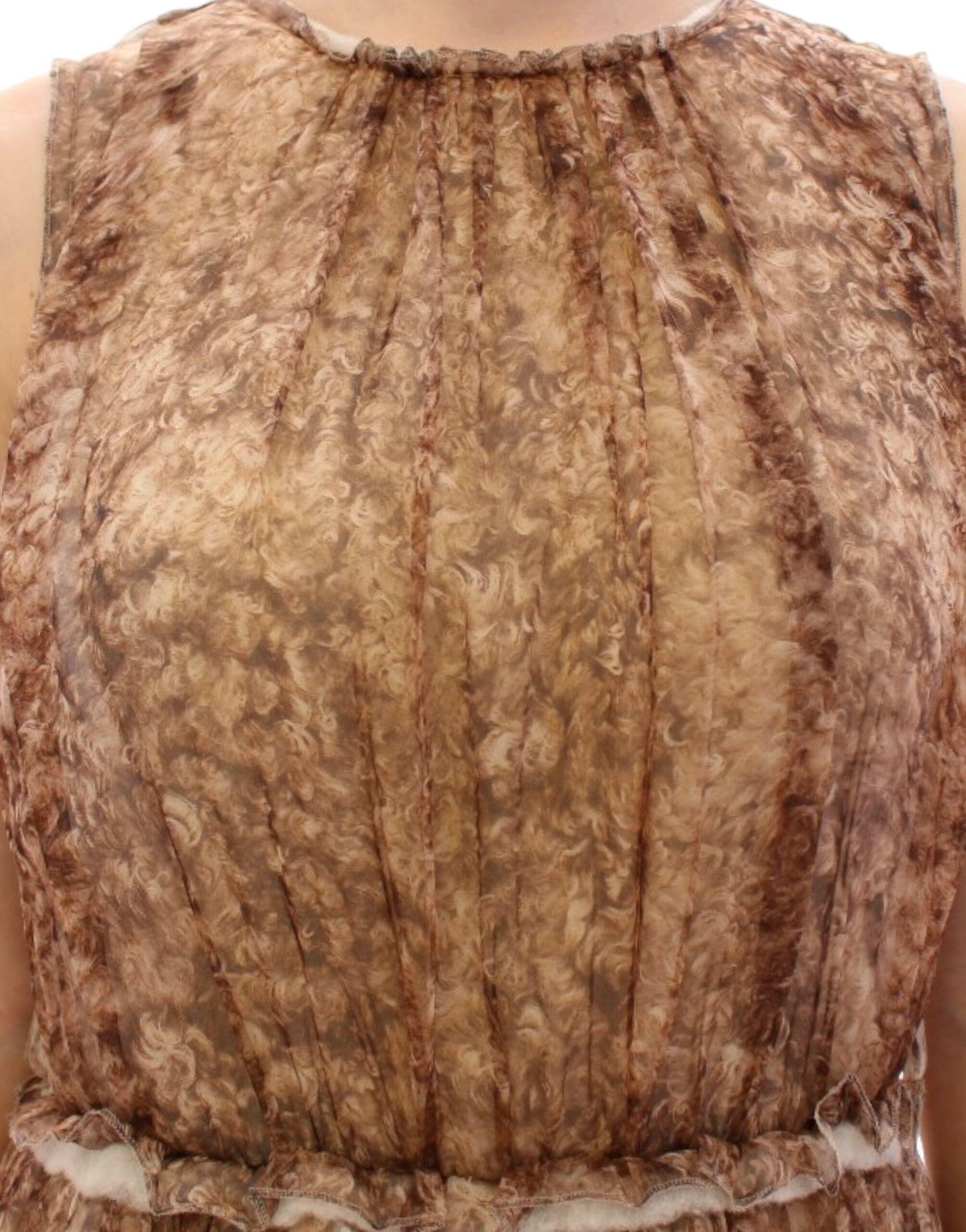 Brown sleeveless silk dress by Dolce & Gabbana displayed on a hanger against a neutral background.