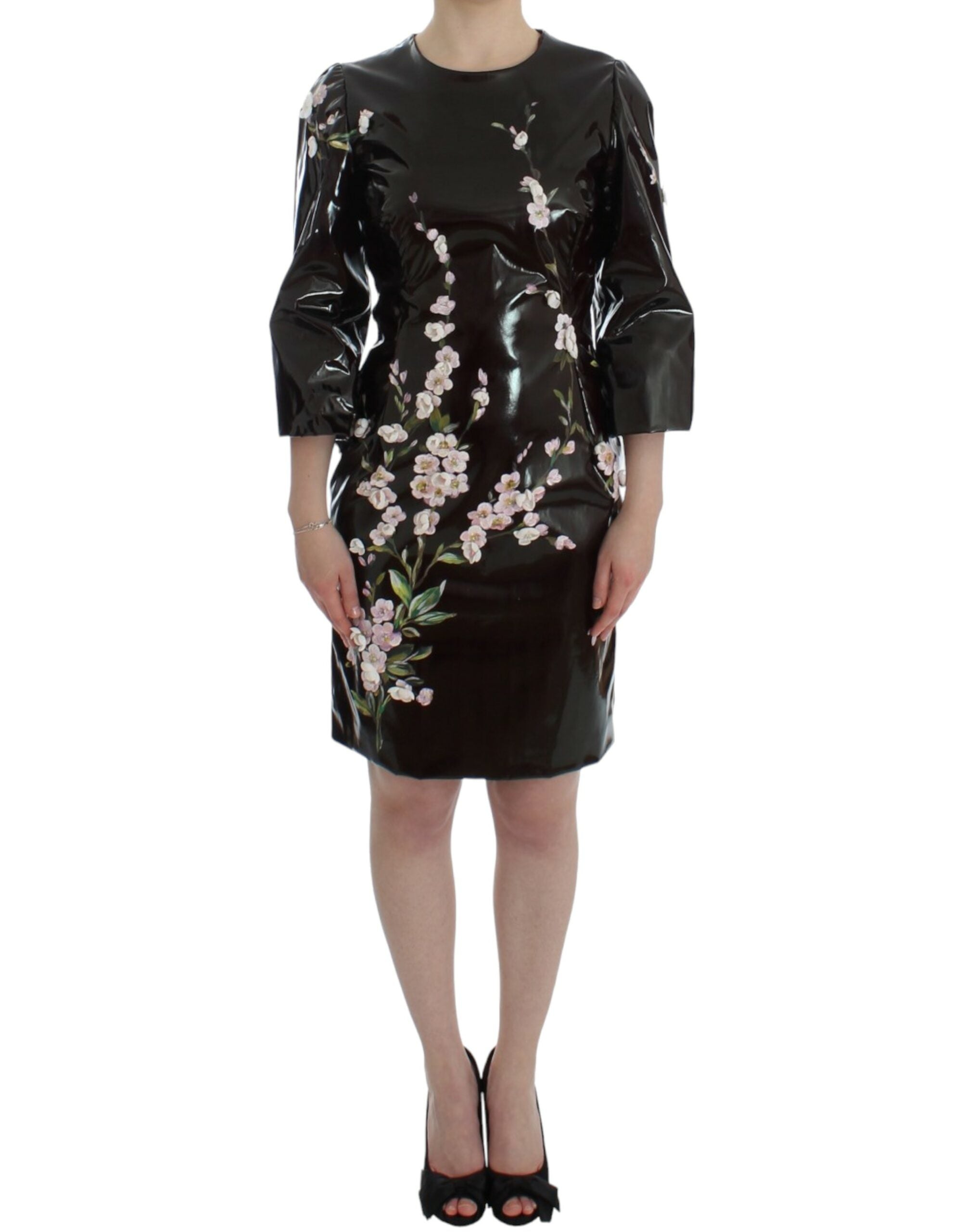 Black floral 3/4 sleeve sheath dress by Dolce & Gabbana, featuring a fitted silhouette and elegant floral pattern.