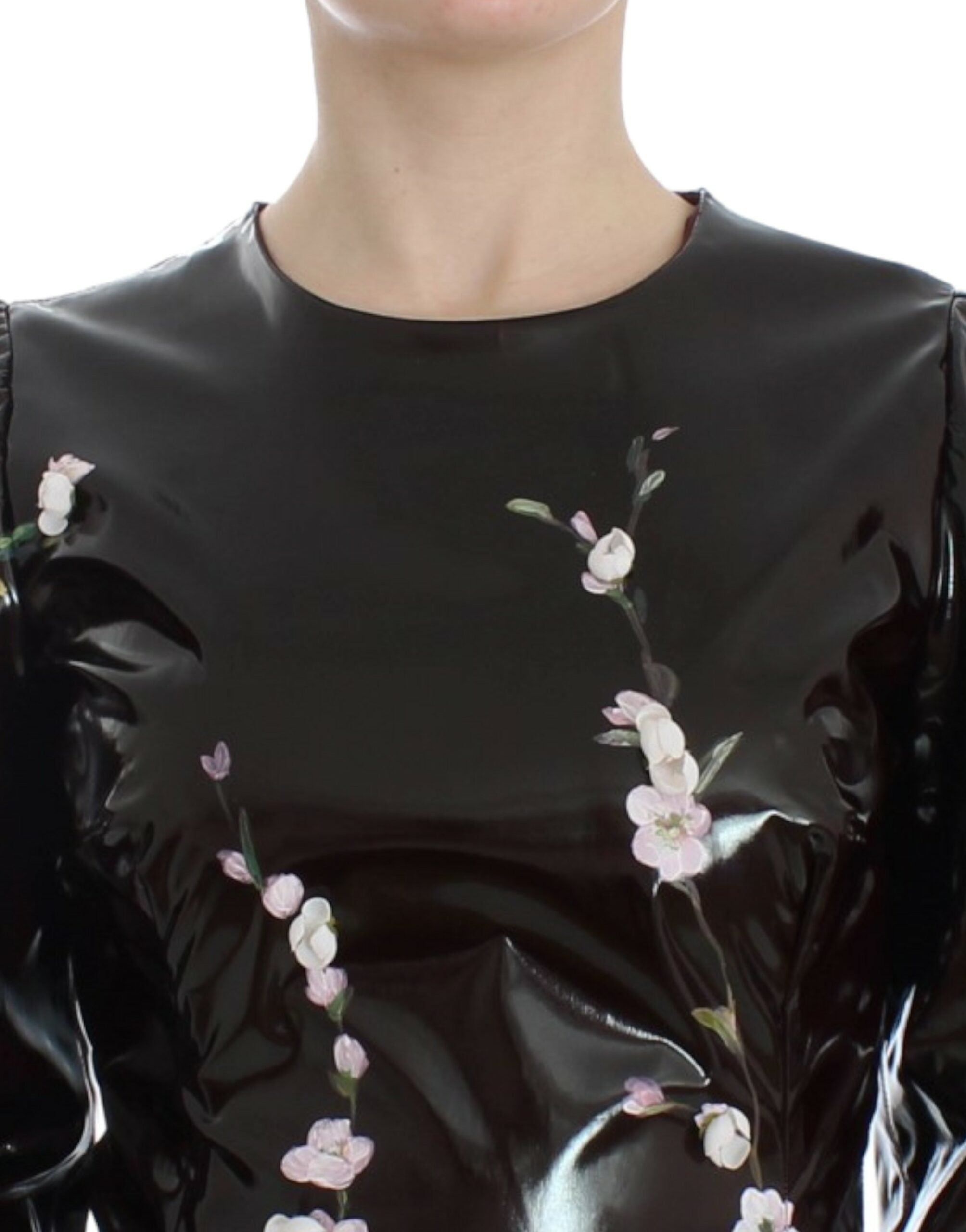 Black floral 3/4 sleeve sheath dress by Dolce & Gabbana, featuring a fitted silhouette and elegant floral pattern.