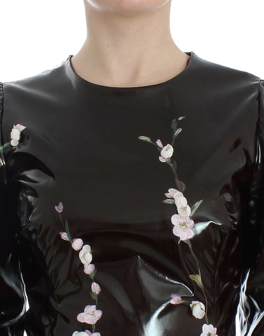 Black floral 3/4 sleeve sheath dress by Dolce & Gabbana, featuring a fitted silhouette and elegant floral pattern.