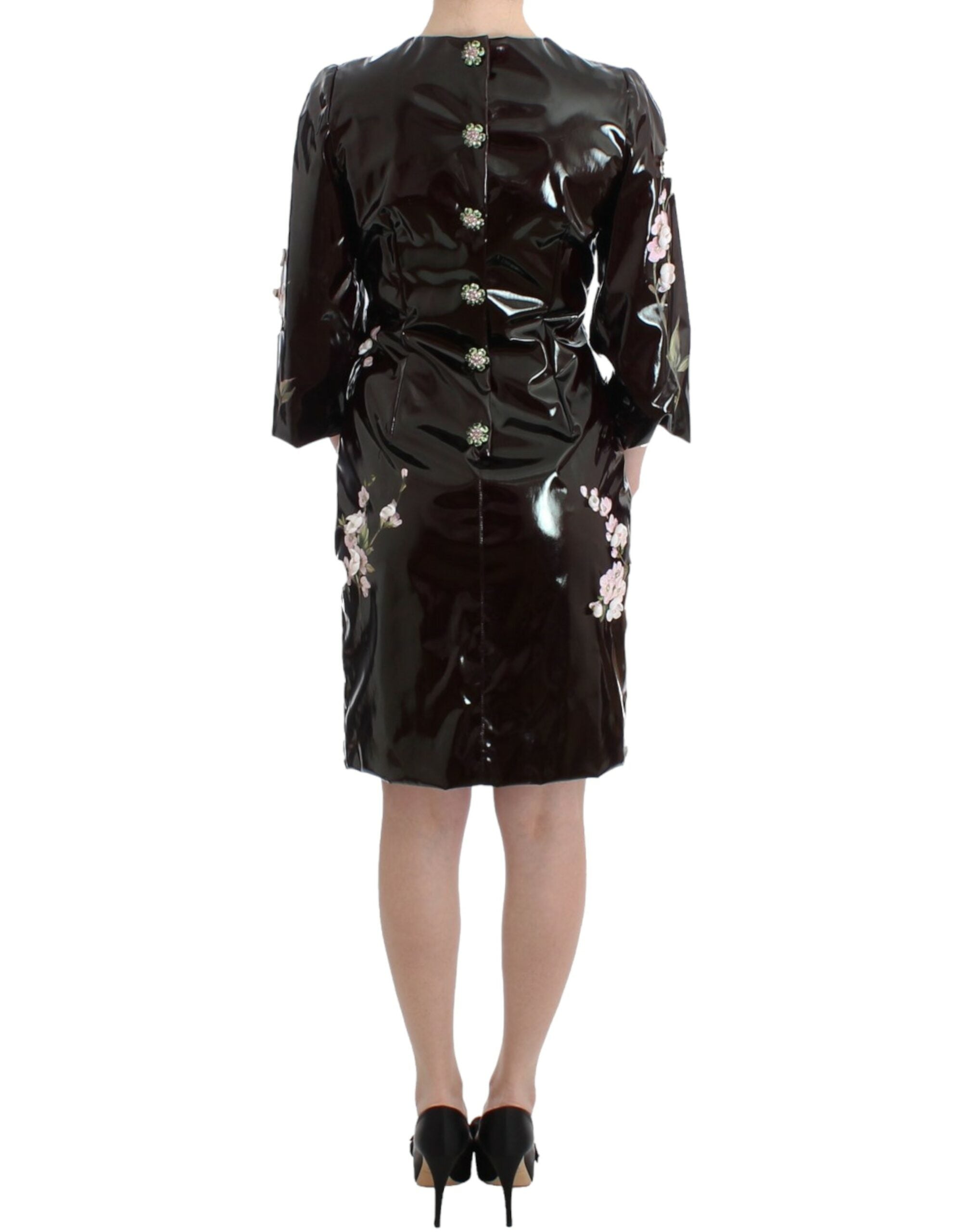 Black patent floral handpainted dress by Dolce & Gabbana, showcasing intricate floral patterns and glossy finish.