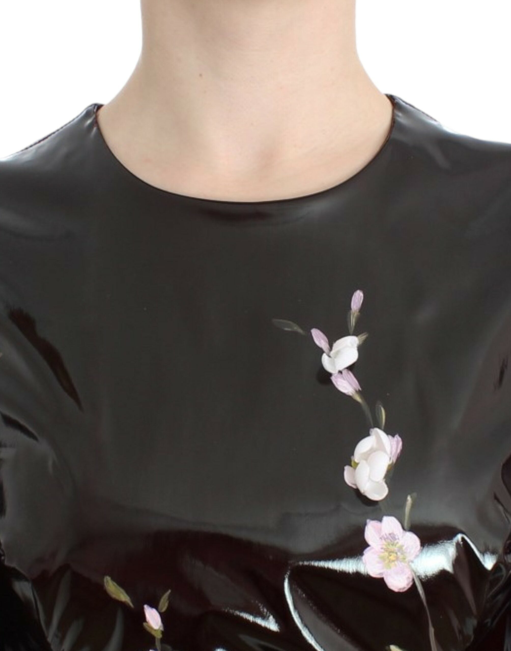 Black patent floral handpainted dress by Dolce & Gabbana, featuring intricate floral designs and a sleek, shiny finish.