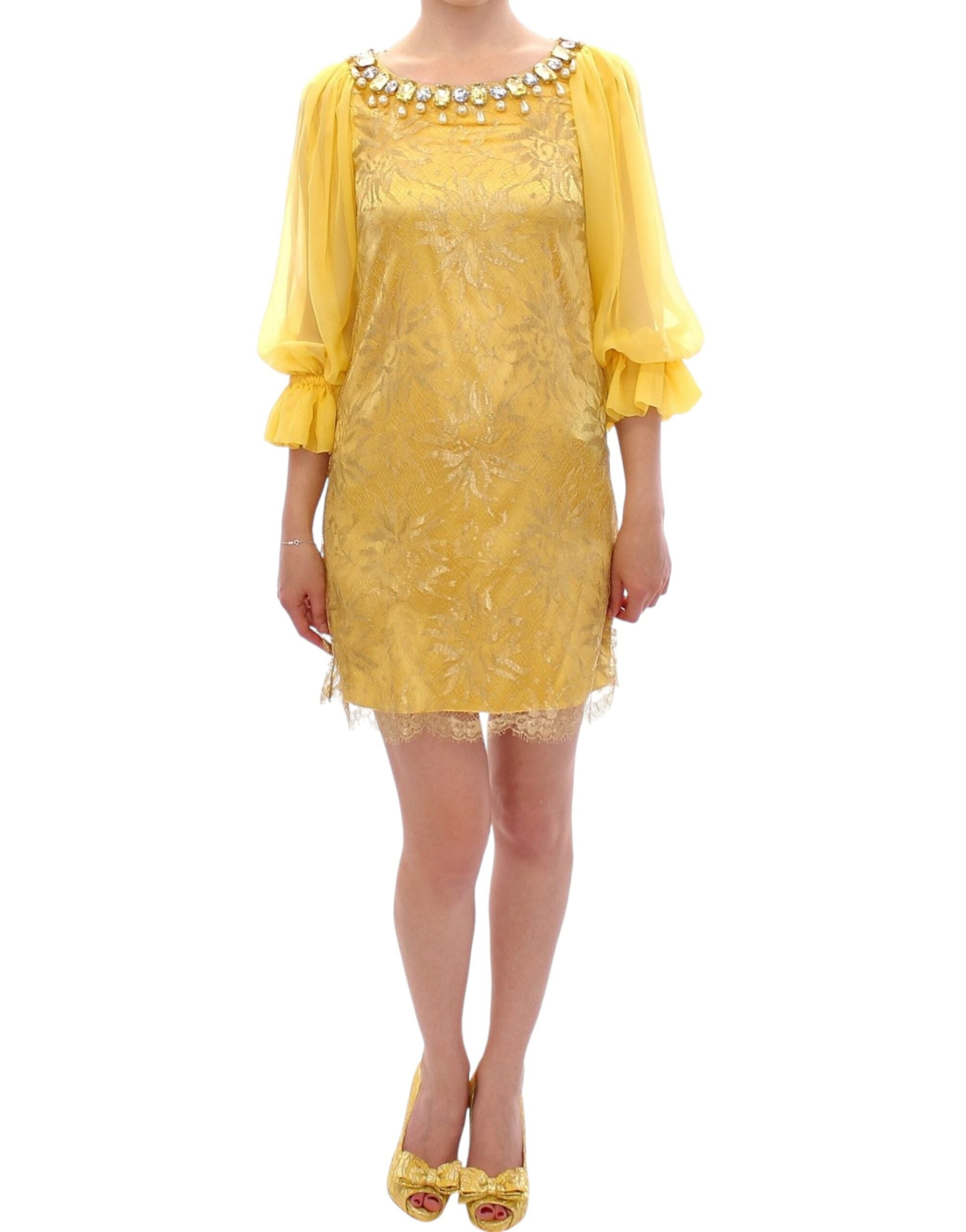 Yellow lace crystal mini dress by Dolce & Gabbana, featuring intricate lace details and sparkling crystal embellishments.
