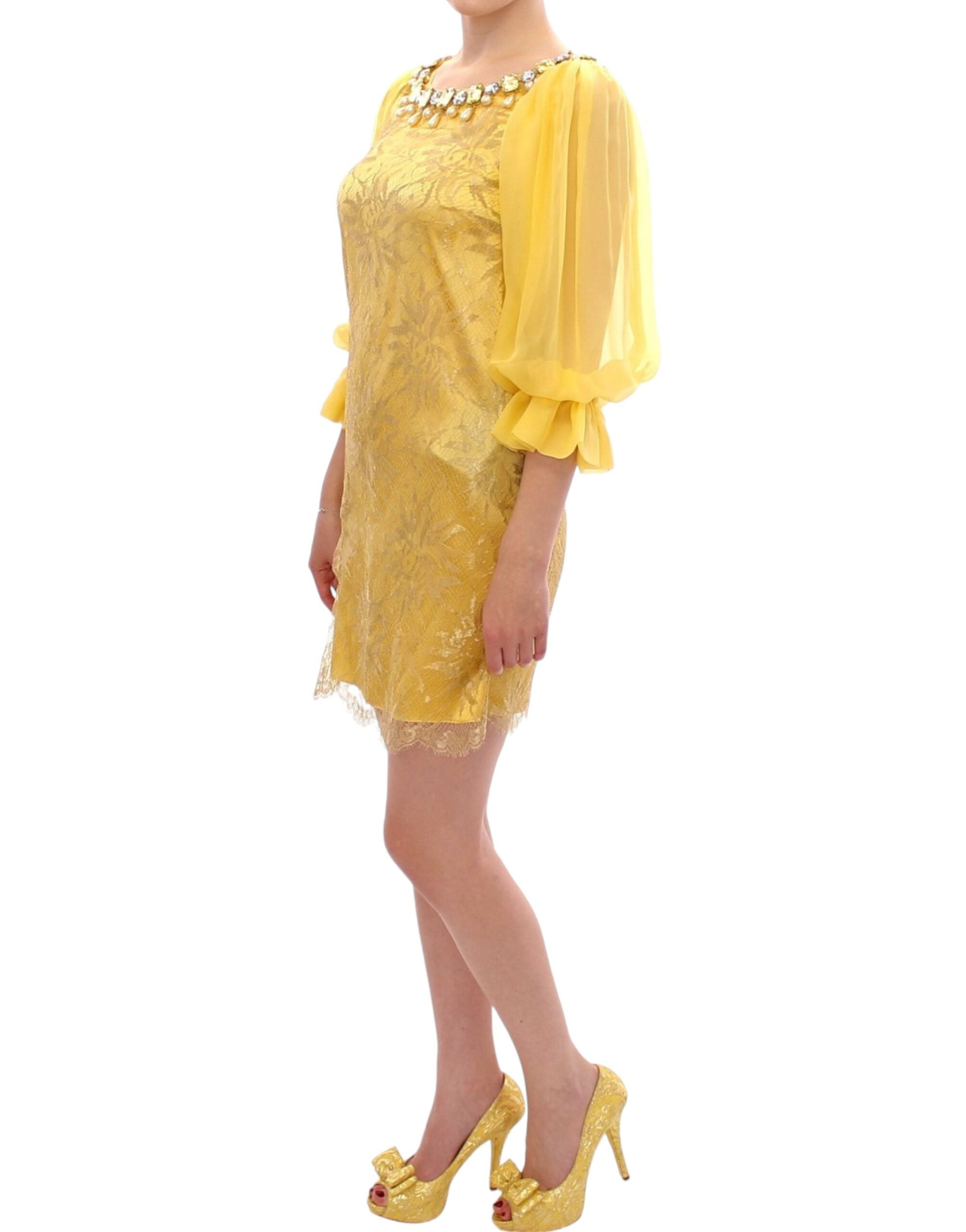 Yellow lace crystal mini dress by Dolce & Gabbana with intricate lace details and sparkling crystal embellishments.