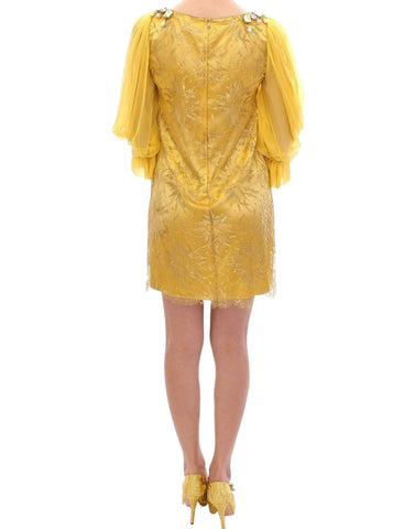 Yellow lace crystal mini dress by Dolce & Gabbana with intricate lace details and sparkling crystal embellishments.