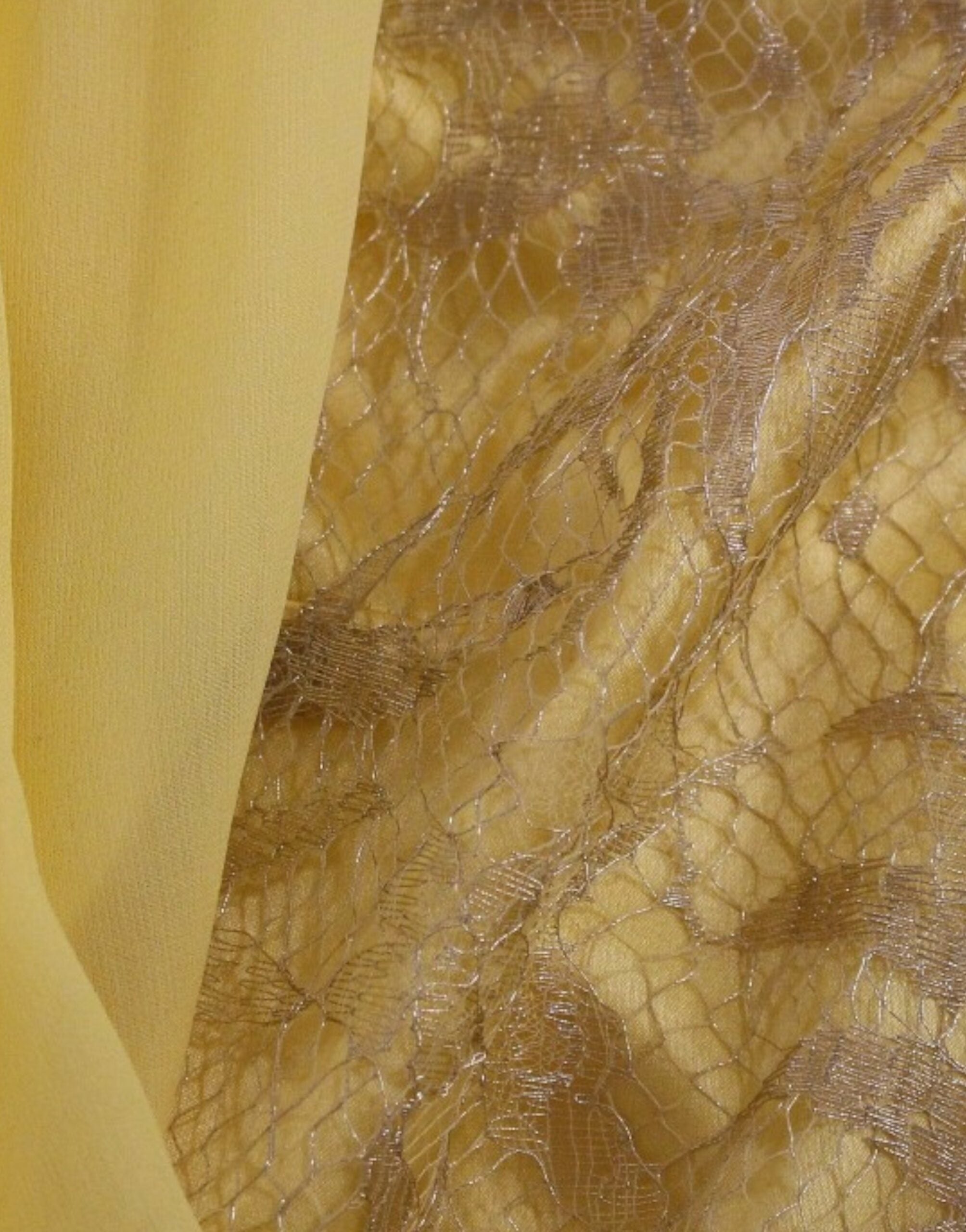 Yellow lace crystal mini dress by Dolce & Gabbana, featuring intricate lace details and sparkling crystal embellishments.