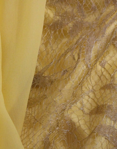 Yellow lace crystal mini dress by Dolce & Gabbana, featuring intricate lace details and sparkling crystal embellishments.