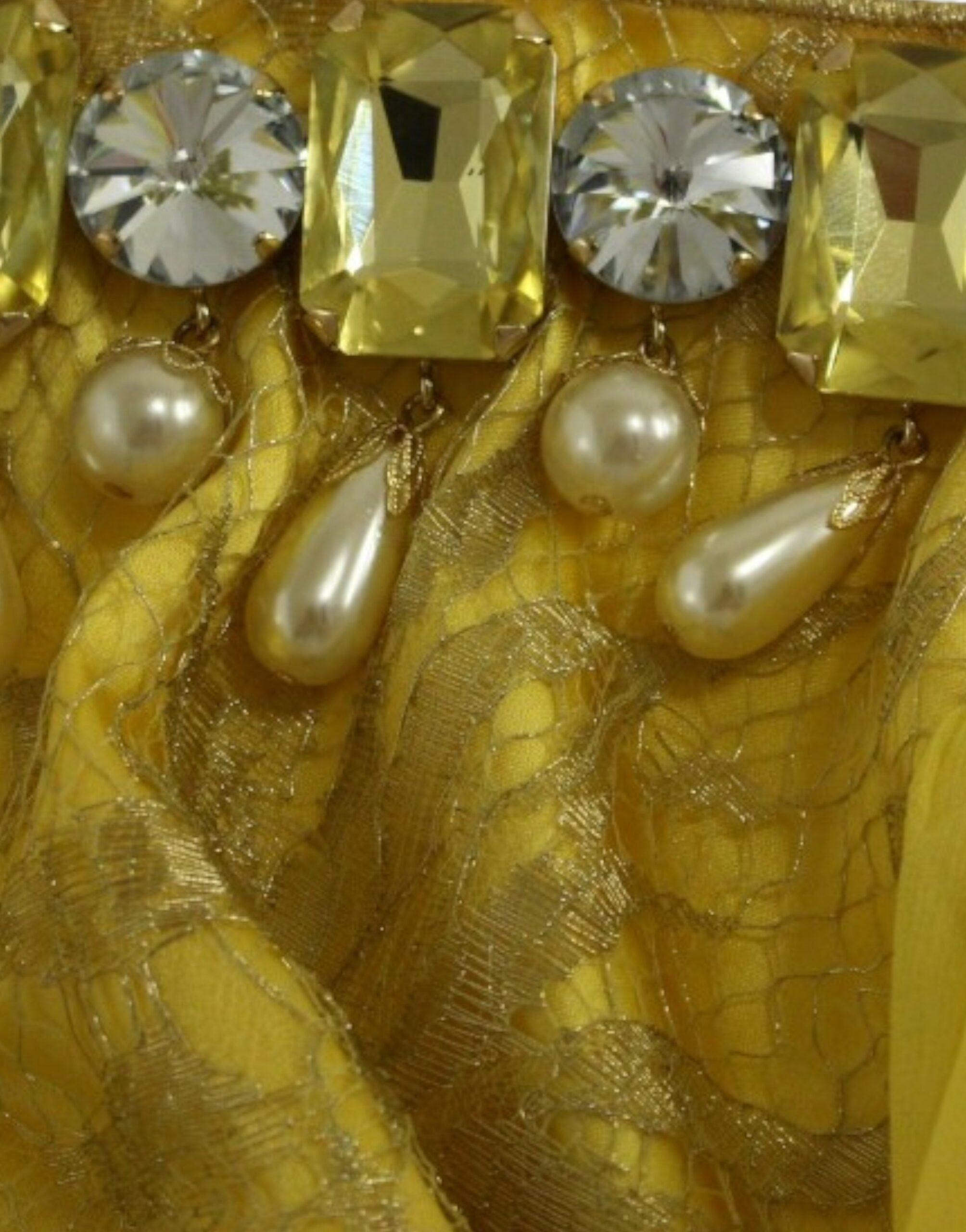 Yellow lace crystal mini dress by Dolce & Gabbana, featuring intricate lace details and sparkling crystal embellishments.