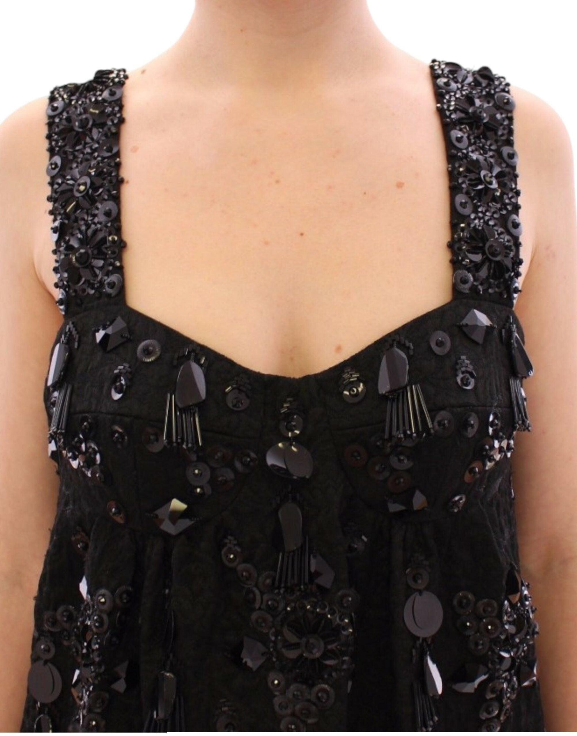 Black floral crystal-embellished dress by Dolce & Gabbana, showcasing intricate floral patterns and shimmering crystal details.