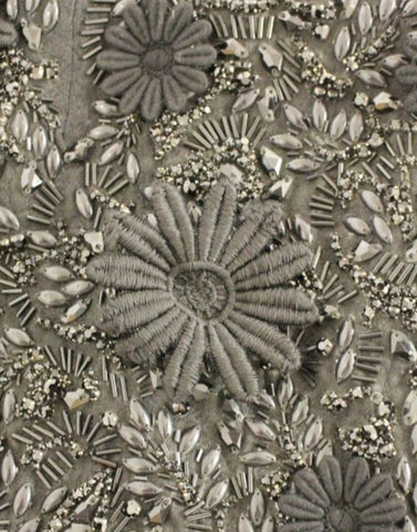 Black floral crystal embedded dress by Dolce & Gabbana, featuring intricate floral embroidery and sparkling crystal details.