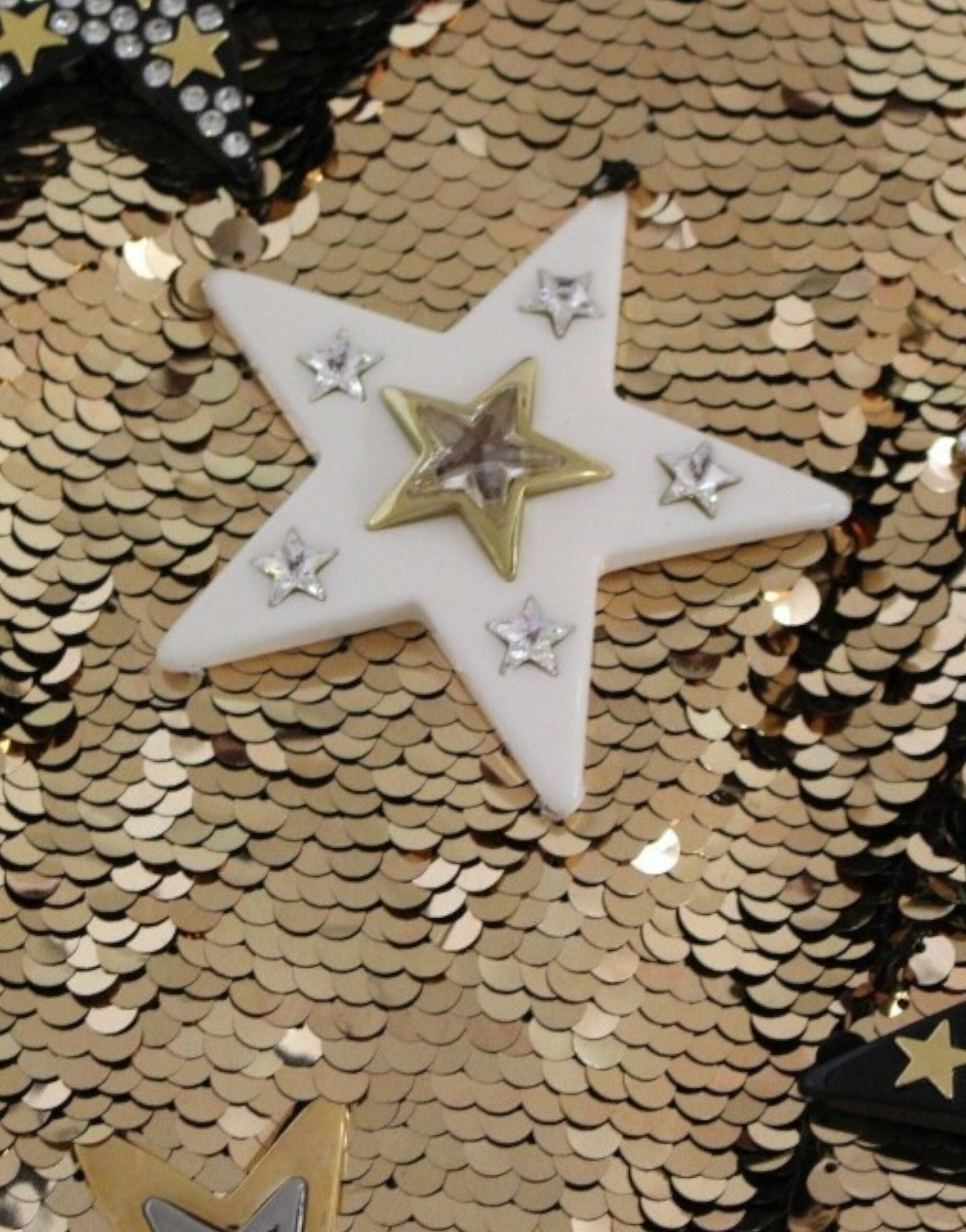 Gold sequined Swarovski dress by Dolce & Gabbana featuring intricate crystal embellishments and a chic, elegant design.