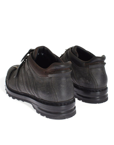 Gray leather ankle strap shoes and boots by Dolce & Gabbana showing sleek design and stylish ankle straps.