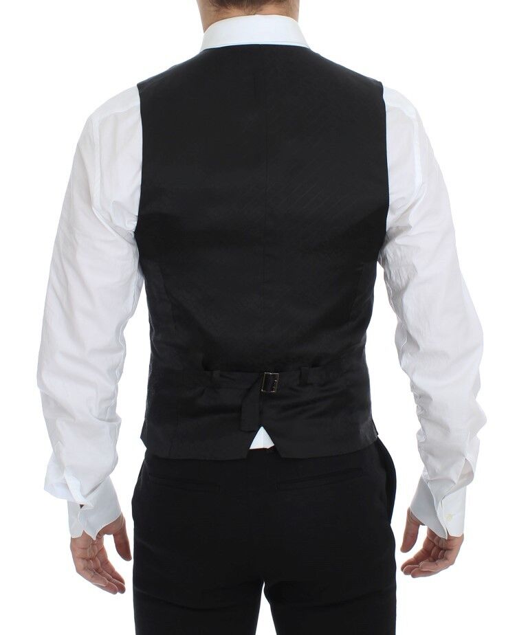 Black striped stretch dress vest gilet by Dolce & Gabbana hanging on a wooden hanger.