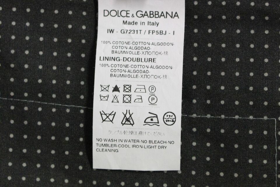 Gray polka dot dress vest by Dolce & Gabbana, stylish gilet with a tailored fit and classic polka dot pattern.