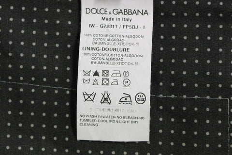 Gray polka dot dress vest by Dolce & Gabbana, stylish gilet with a tailored fit and classic polka dot pattern.
