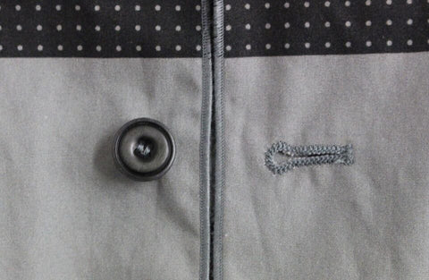 Gray polka dot dress vest by Dolce & Gabbana, stylish gilet with classic pattern, tailored fit, and sleeveless design.