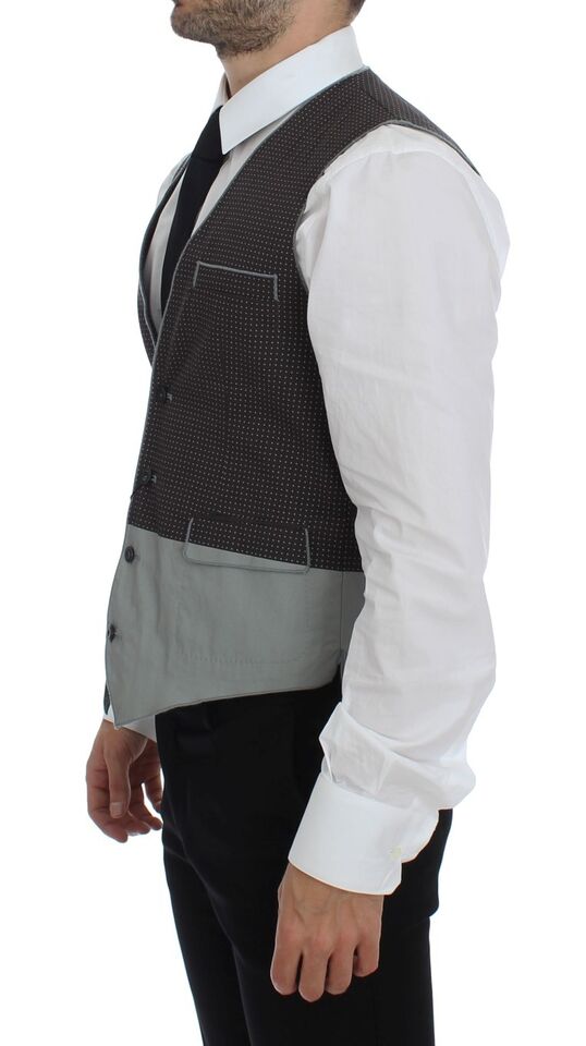 Gray polka dot dress vest by Dolce & Gabbana, stylish gilet with button details and tailored fit, ideal for elegant outfits.