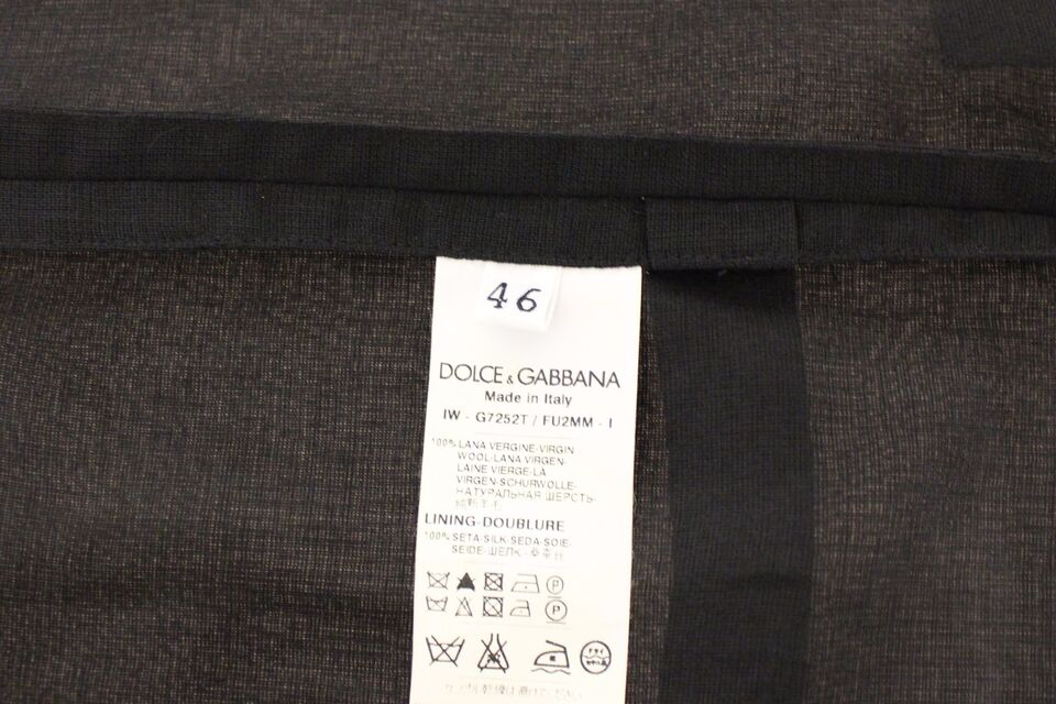 Black wool formal dress vest by Dolce & Gabbana, tailored gilet jacket with sleek design and structured fit.