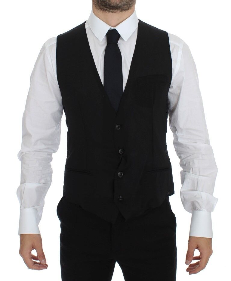 Black wool formal dress vest gilet jacket by Dolce & Gabbana, tailored fit with sleek lapel and button closure, displayed on a hanger.
