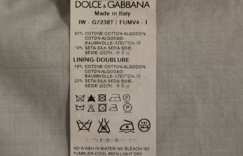 Beige silk blend formal vest gilet by Dolce & Gabbana, showing a tailored sleeveless dress with a smooth, elegant fabric finish.